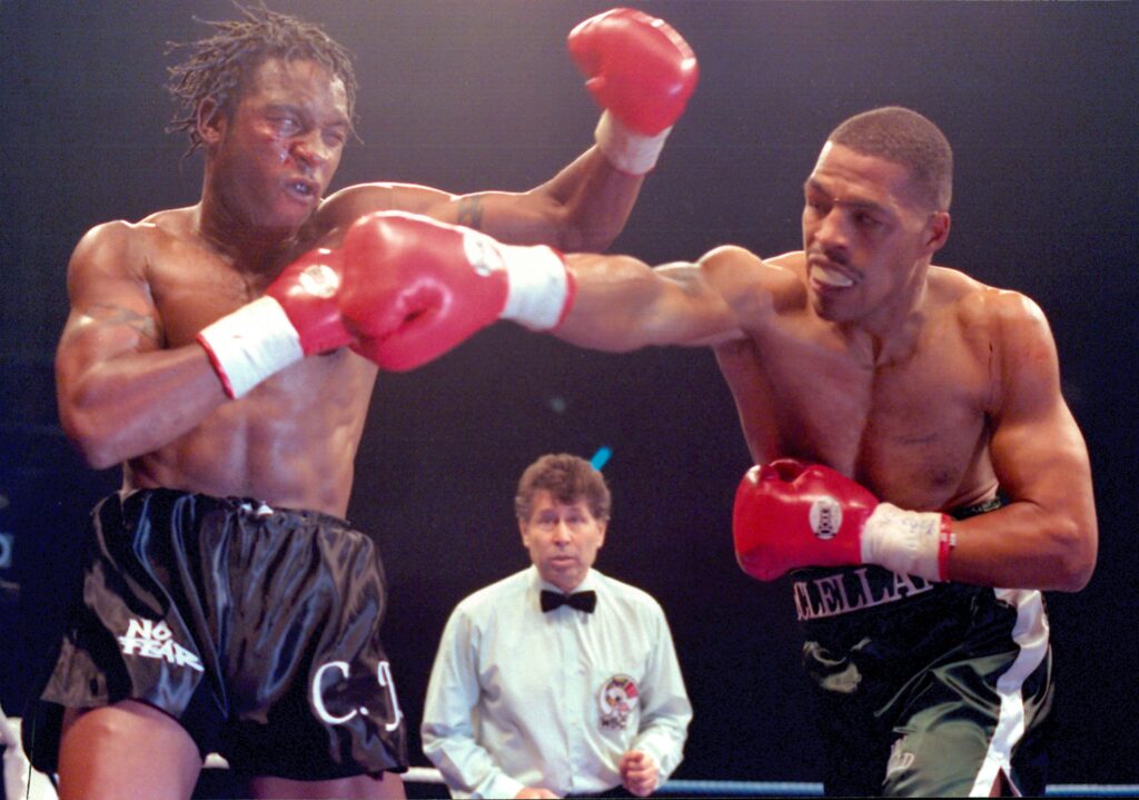 Nigel Benn throws a left hook at Gerald McClellan during their super middleweight title fight in 1995