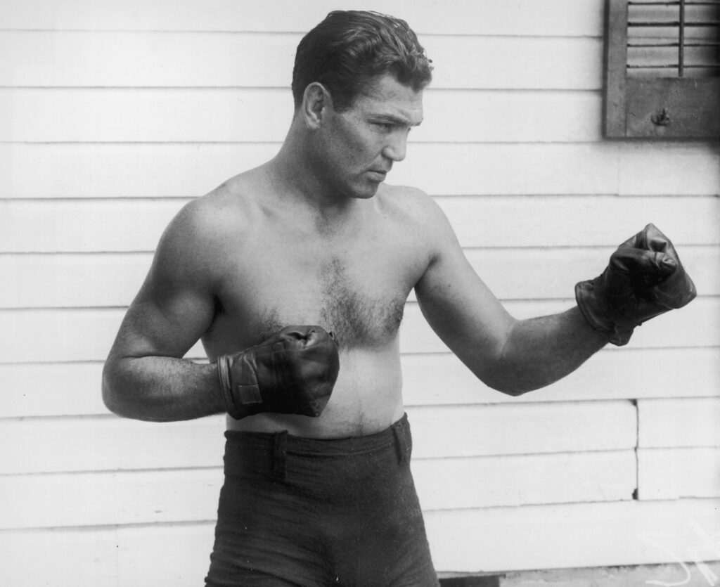 Jack Dempsey strikes a pose during a photoshoot in 1925