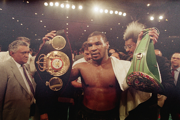 Mike Tyson holds the IBF and WBA heavyweight titles after his win over Tony Tucker in 1987