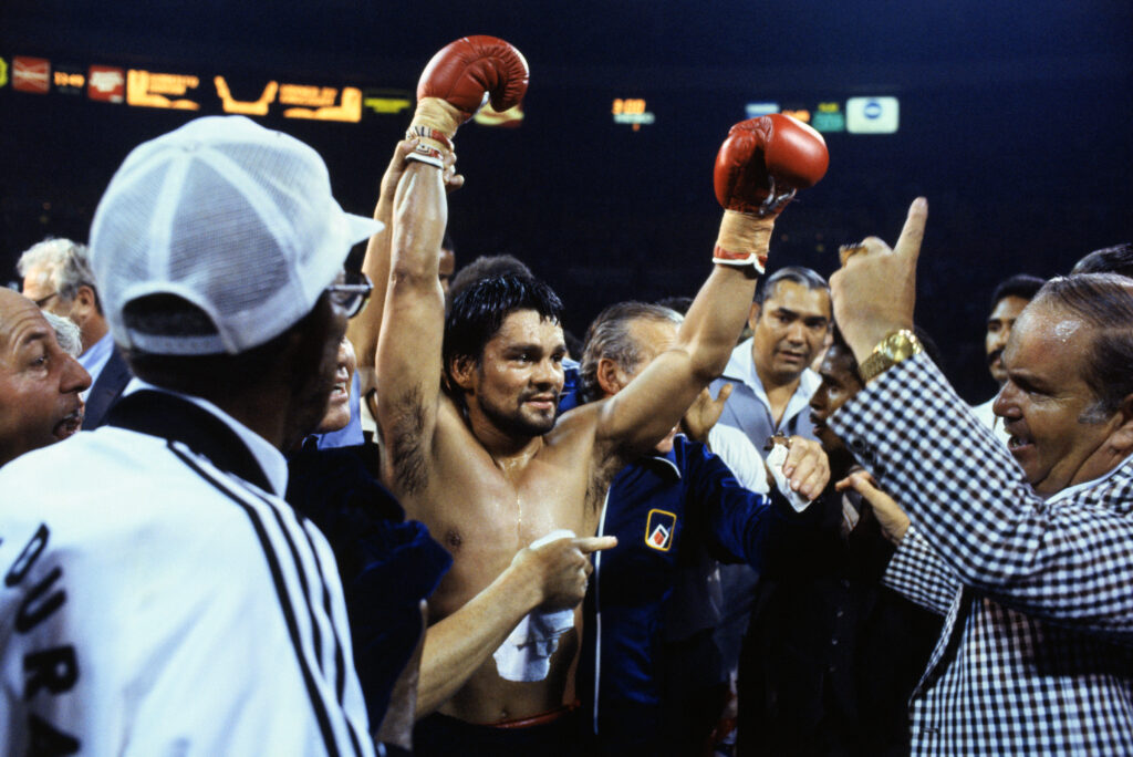 Roberto Duran Holding His Arms up After Victory