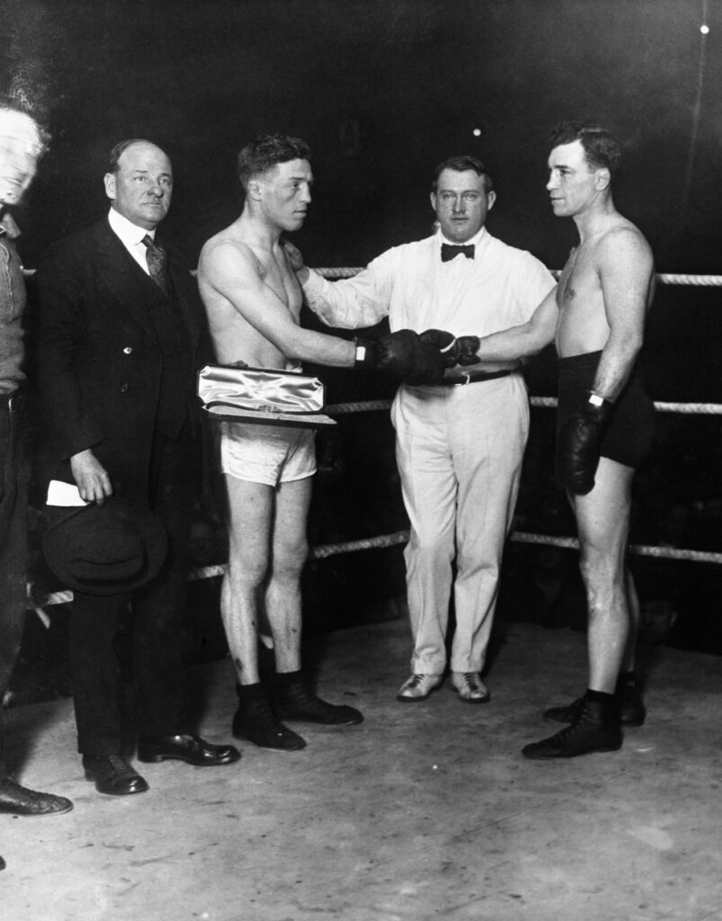 Ted Lewis shakes hands with Jack Britton during their welterweight world championship fight at Madison Square Garden in 1915