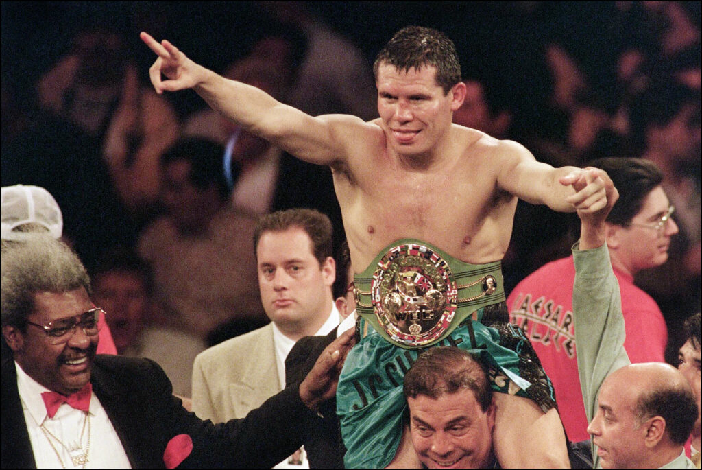 Julio Cesar Chavez celebrates after defending his super lightweight titles in his win over Giovanni Parisi