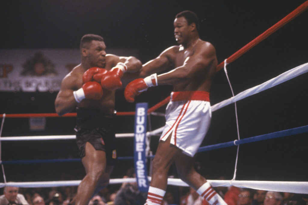 Mike Tyson punches Larry Holmes during their 1988 heavyweight title fight in Atlantic City.