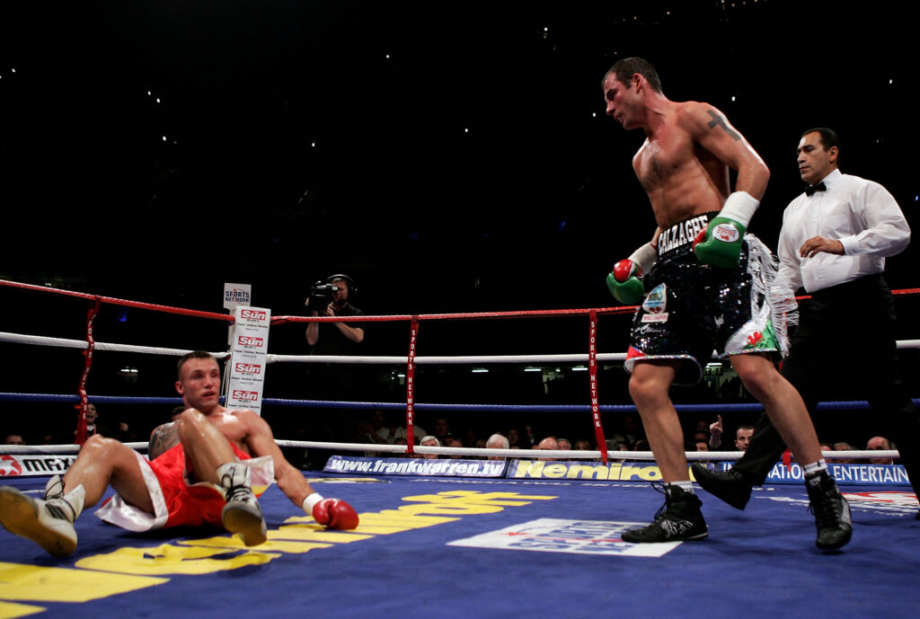 Joe Calzaghe knocks down Mikkel Kessler during their super middleweight title fight in Cardiff, Wales in 2007