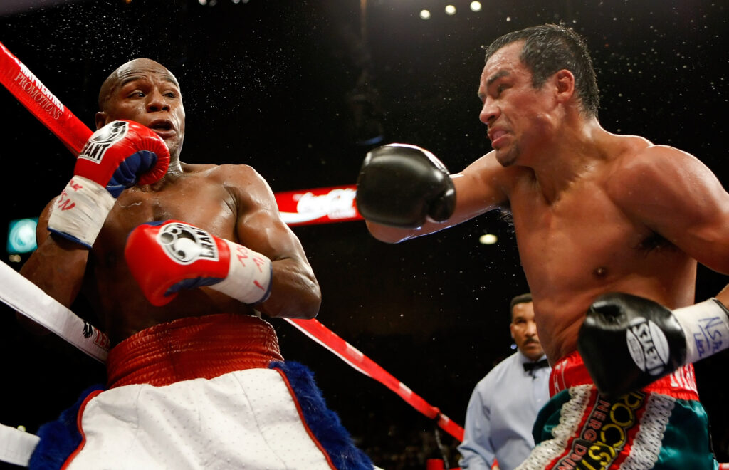 Juan Manuel Marquez throws a punch at Floyd Mayweather during their 2009 non-title fight in Las Vegas