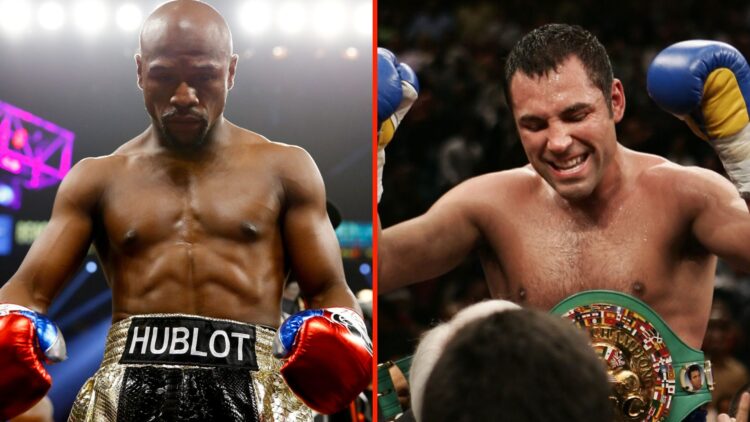 Floyd Mayweather Jr looks down as he stands in the ring before his fight with Manny Pacquiao and Oscar De La Hoya celebrates after defeating Ricard...