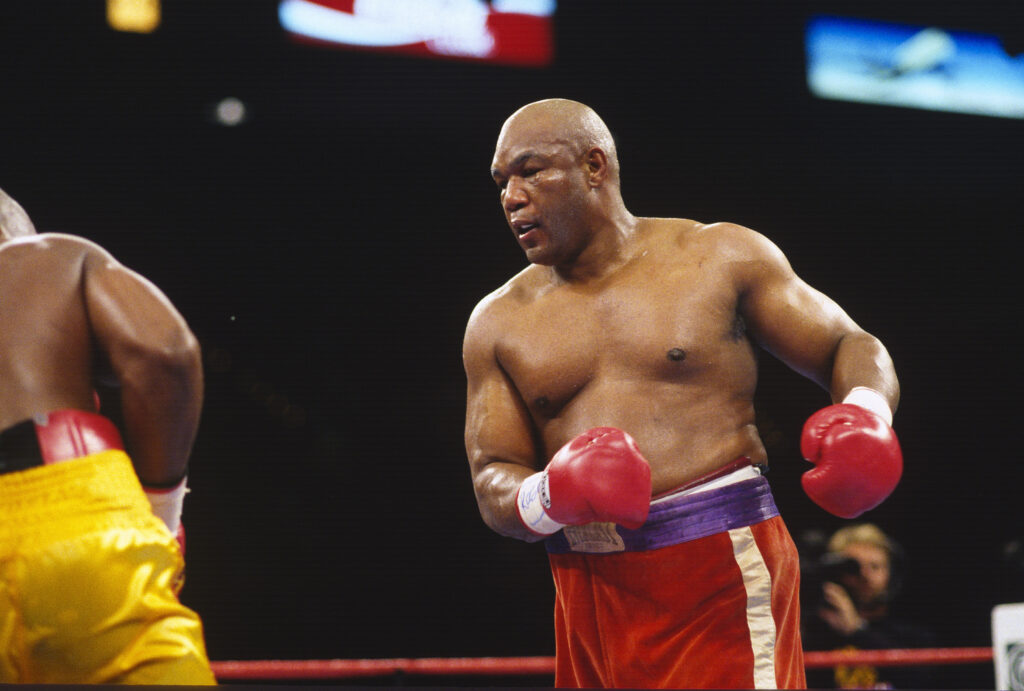 George Foreman throws a punch at Michael Moorer during their heavyweight title fight in 1994