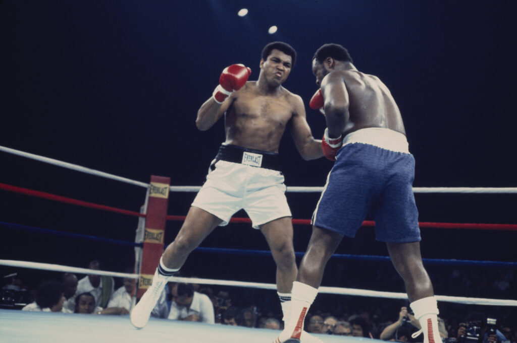 Muhammad Ali throws a left to the body of Joe Frazier