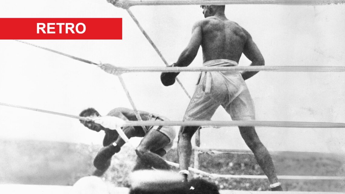 Jack Dempsey stands over Georges Carpentier in the Ring after knocking him down